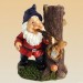 Foto 1 van Dode tuinkabouters : Tuinkabouter met pistool in mond