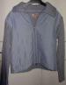 Foto 1 van Lichtblauw vestje (maat 140)